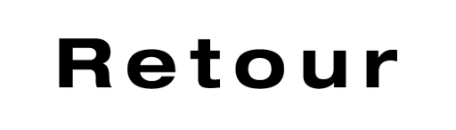 Holzstempel mit Text: Retour 